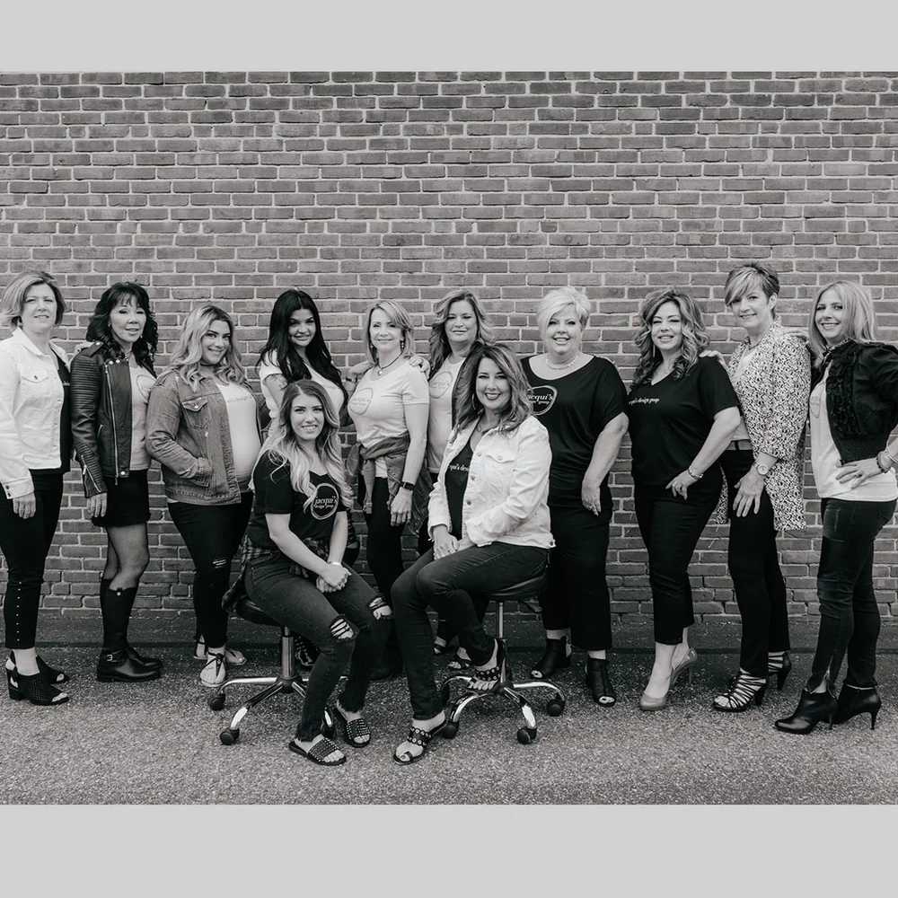 The Jacqui's Design Group stylist team outside the salon in Arlington, MA